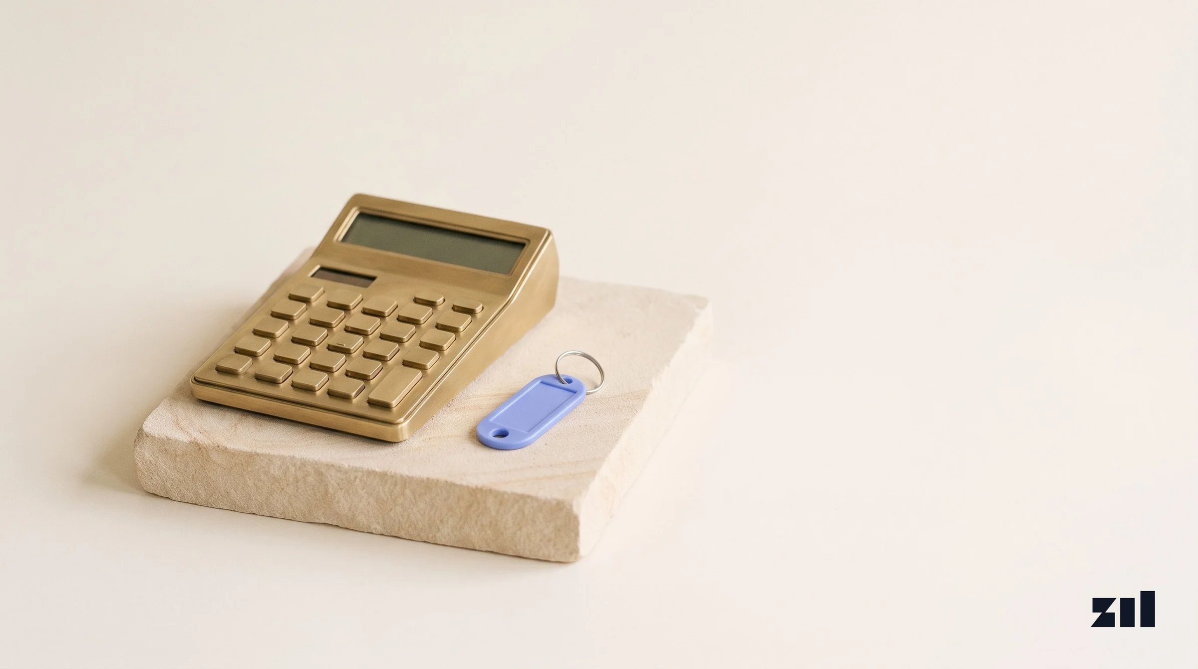 Brass calculator on stone, illustrating rising TikTok ad costs in 2026.