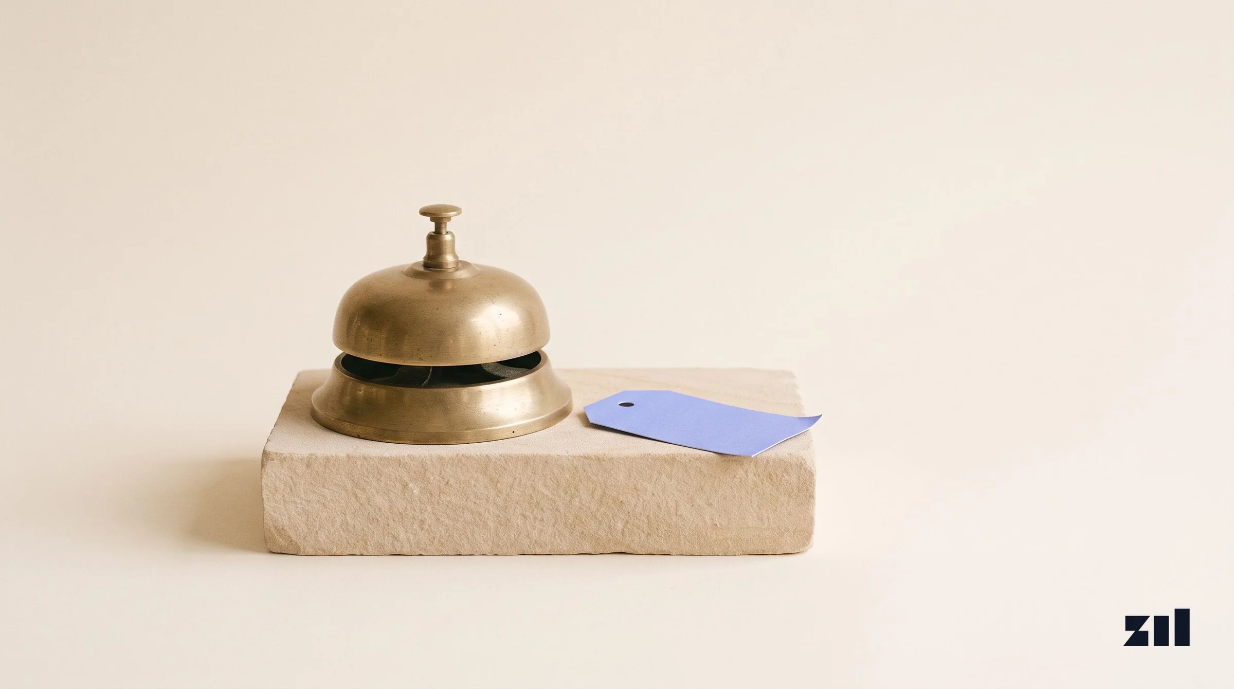 Brass desk bell on stone, illustrating AI implementation for consulting firm marketing.