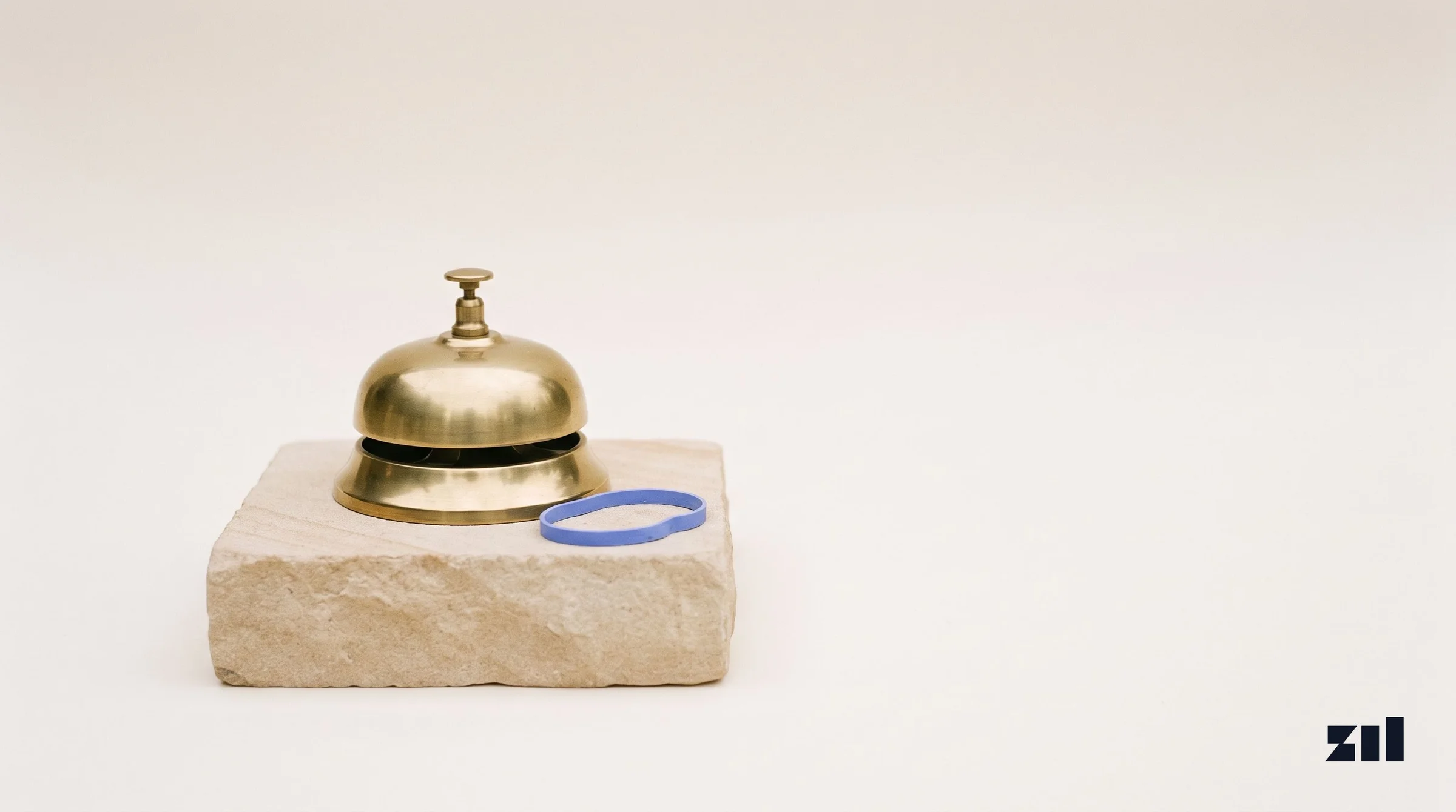 Brass desk bell on stone, illustrating a guide on testing business visibility.